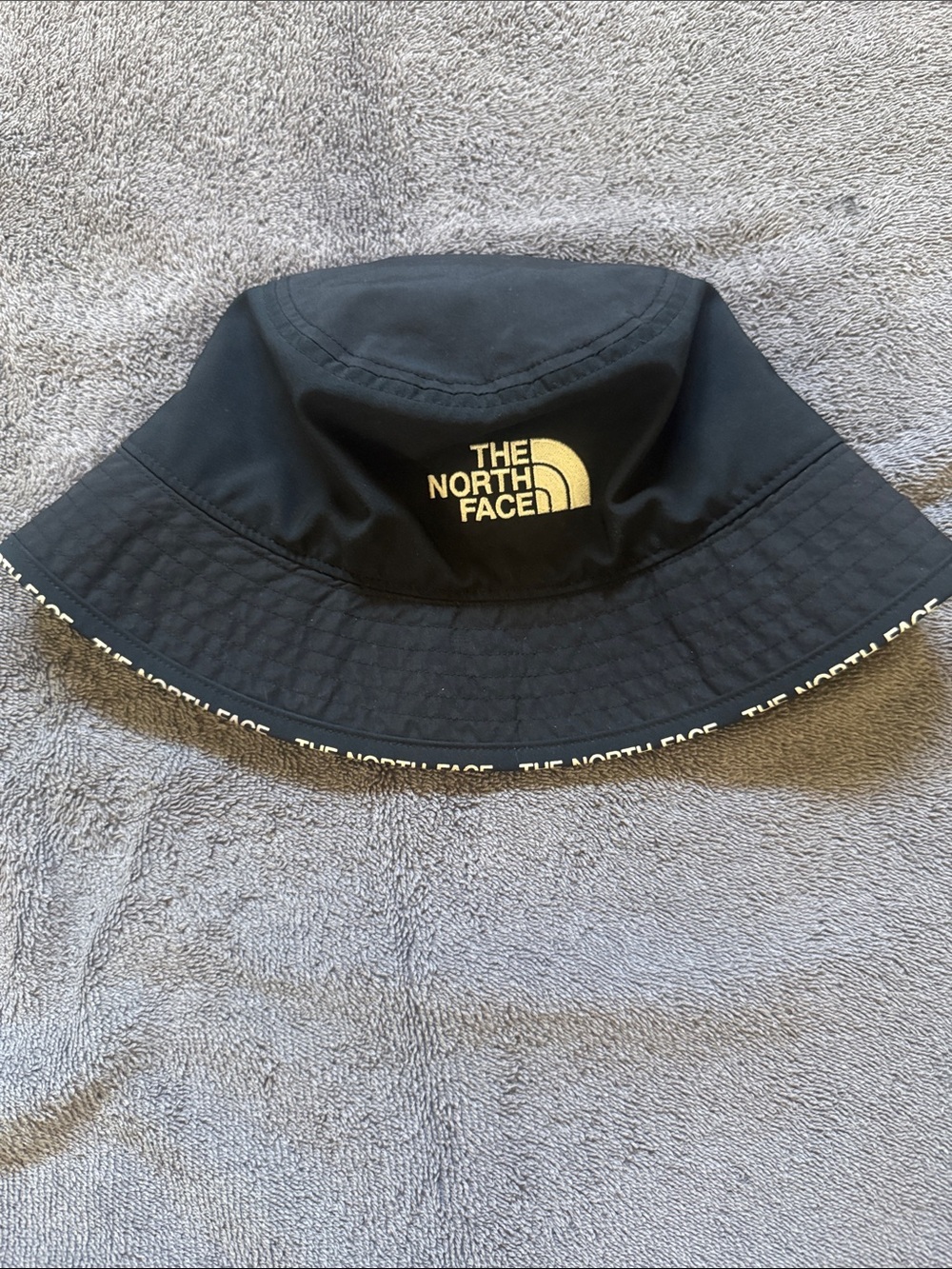 The North Face Black Bucket Hat with White Logo Trim